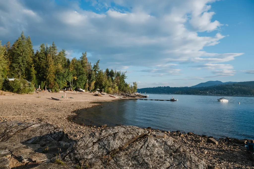 Rocky shoreline with dock and boat